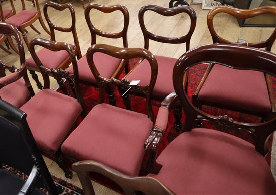 Six Victorian mahogany buckle back dining chairs (4 drop-in seats, 2 stuffover seats) and a pair of later mahogany open armchairs,